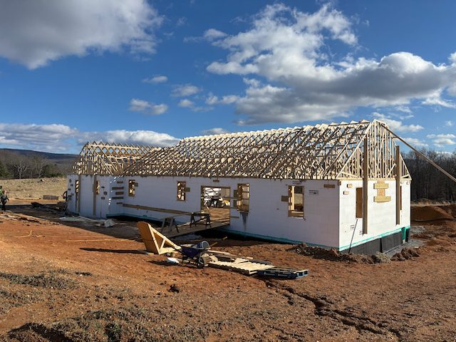 Insulated concrete forms stacked and braced on a foundation